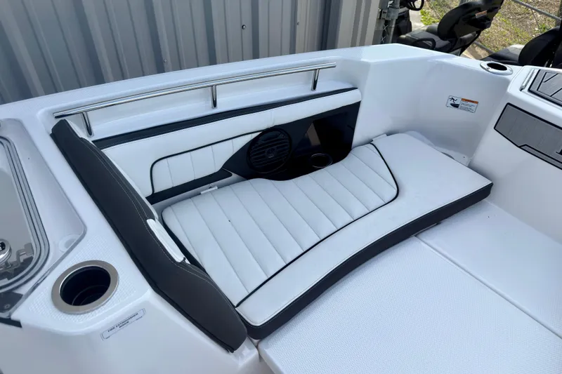 Slide: The Image of Interior seating of 2026 Yamaha Boats 255 FSH Sport H, featuring white cushioned seats. - 17
