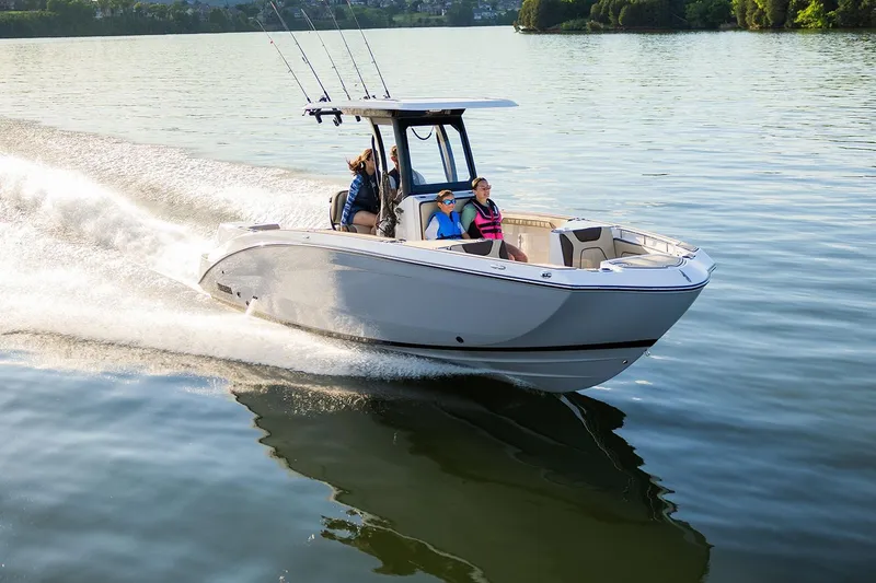 Slide: The Image of Simrad display on 2026 Yamaha Boats 255 FSH Sport H, reflecting building exterior. - 3