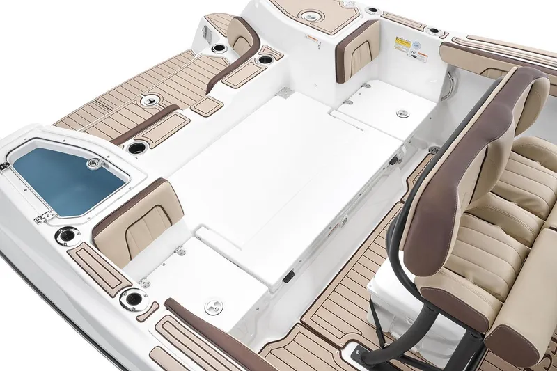 Slide: The Image of 2026 Yamaha Boats 255 FSH Sport H interior with cushioned seating and storage compartments. - 8