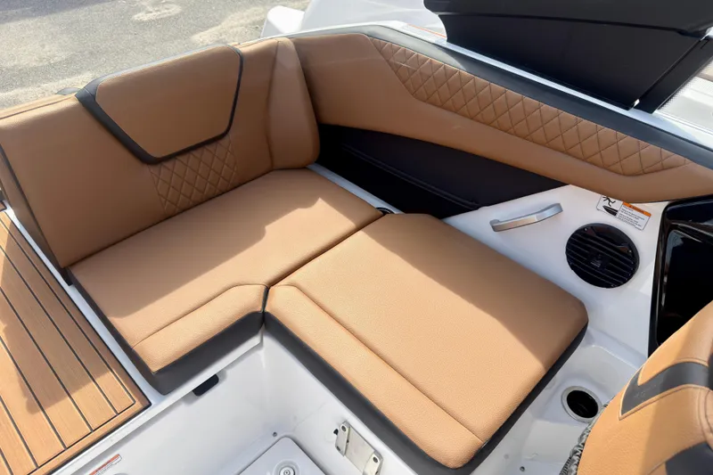 Slide: The Image of Luxurious seating on 2026 Yamaha Boats 222SD, featuring tan upholstery and modern design. - 15