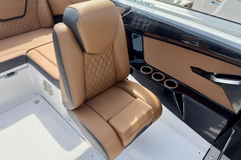 Slide: The Image of 2026 Yamaha Boats 222SD interior with tan leather seating and sleek design. - 16