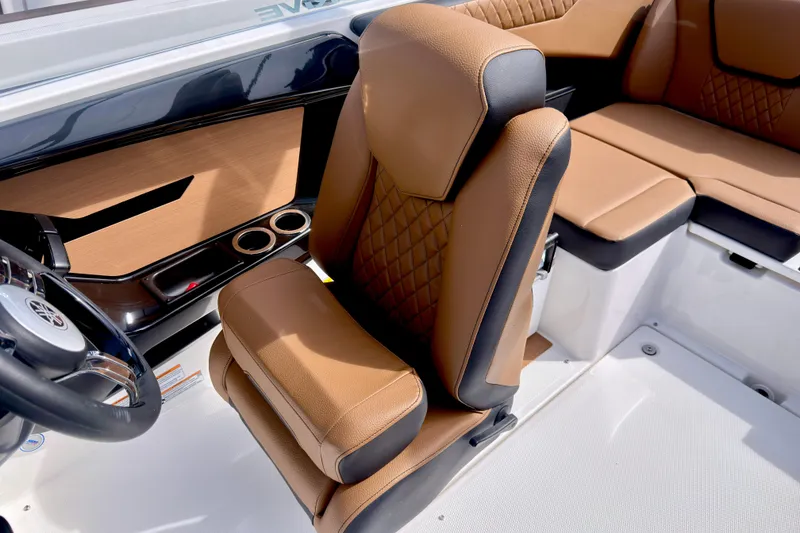 Slide: The Image of 2026 Yamaha Boats 222SD interior with tan leather seating and steering wheel. - 18