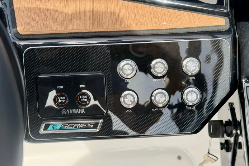 Slide: The Image of Control panel of 2026 Yamaha Boats 222SD, featuring start/stop buttons and accessory switches. - 21