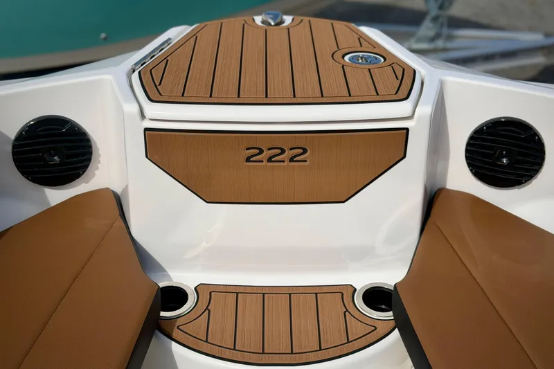 Slide: The Image of 2026 Yamaha Boats 222SD interior with teak accents and speaker system. - 23