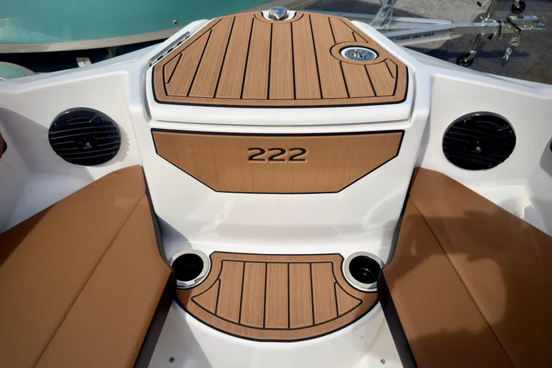 Slide: The Image of 2026 Yamaha Boats 222SD interior with teak accents and brown seating. - 26