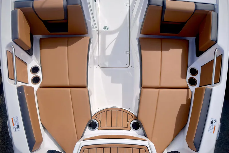 Slide: The Image of 2026 Yamaha Boats 222SD interior with tan seating and cup holders. - 27