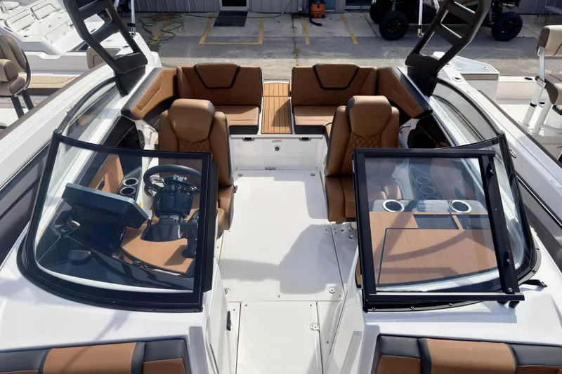 Slide: The Image of 2026 Yamaha Boats 222SD interior with luxurious seating and modern dashboard design. - 28