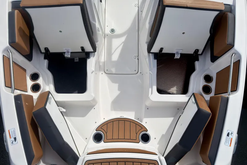 Slide: The Image of 2026 Yamaha Boats 222SD interior seating with storage compartments and cup holders. - 29