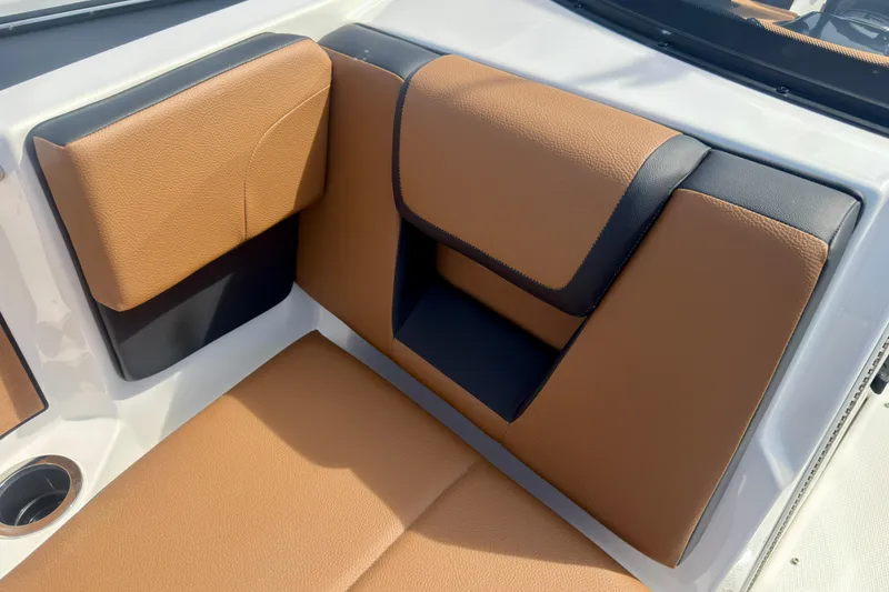 Slide: The Image of 2026 Yamaha Boats 222SD interior with tan and black seating. - 30