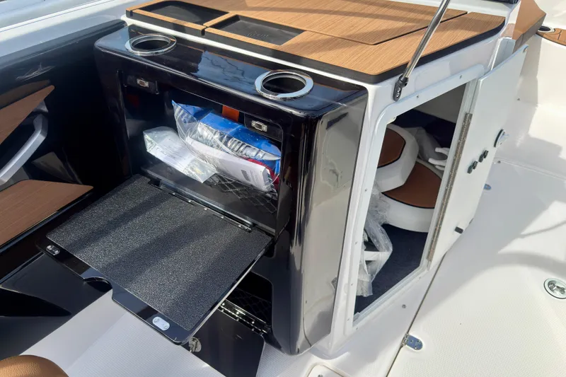 Slide: The Image of 2026 Yamaha Boats 222SD interior with storage compartment and modern design features. - 36