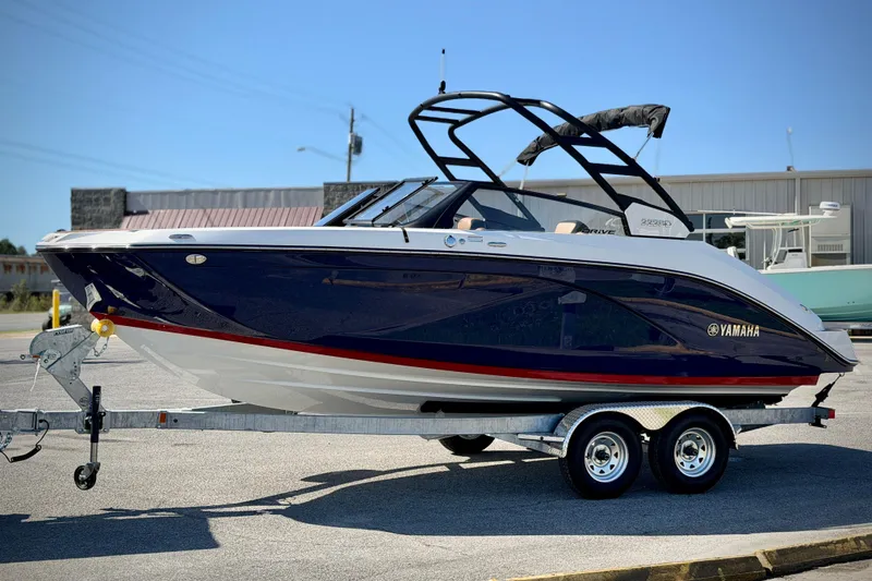 Slide: The Image of 2026 Yamaha Boats 222SD on trailer, sleek design, blue and white exterior. - 5