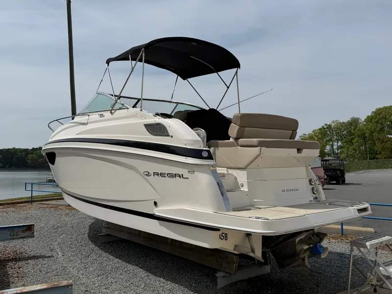 The Image of 2013 Regal 28 Express boat on a dock. - 0