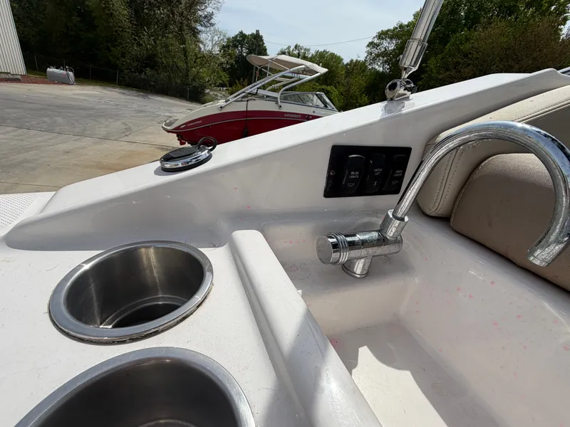 Slide: The Image of 2013 Regal 28 Express with stainless steel cup holders and faucet. - 13