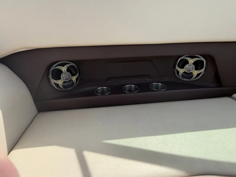 Slide: The Image of Speakers and cup holders in a 2013 Regal 28 Express boat. - 15