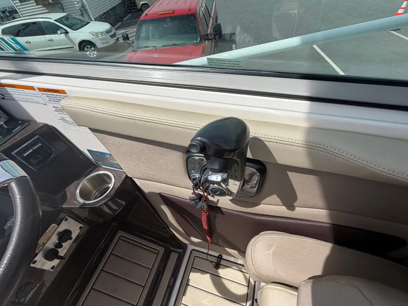 Slide: The Image of Interior of a 2013 Regal 28 Express boat with control console. - 19