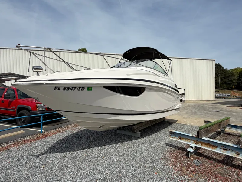 Slide: The Image of 2013 Regal 28 Express boat parked on a trailer. - 2