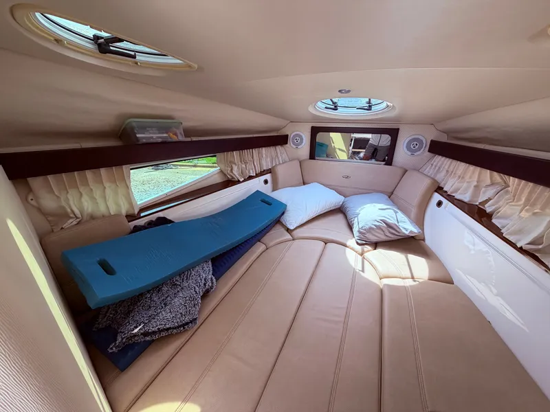 Slide: The Image of Interior of a 2013 Regal 28 Express yacht with cozy bed. - 24