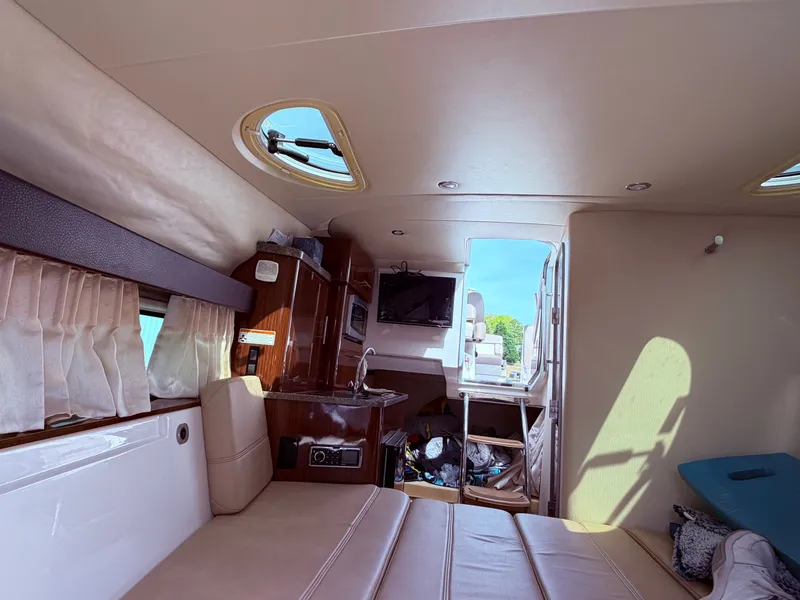 Slide: The Image of Interior of a 2013 Regal 28 Express yacht with comfortable amenities. - 25