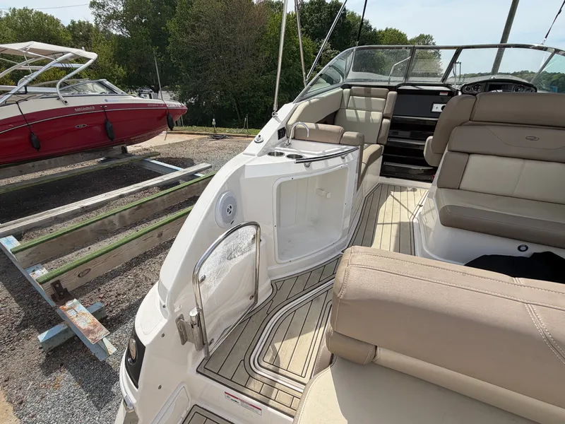 Slide: The Image of Interior of a 2013 Regal 28 Express boat with seating area. - 8