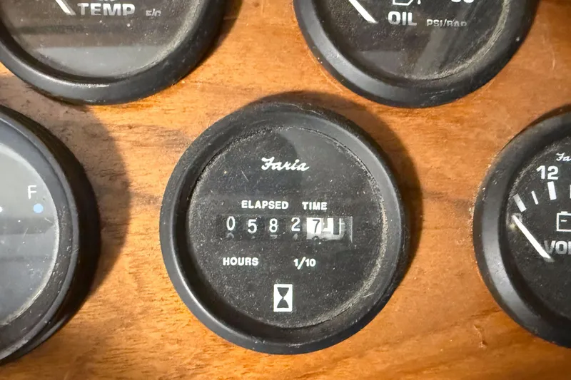 Slide: The Image of Close-up of Faria elapsed time gauge on 1977 Pacemaker FB Motor Yacht dashboard. - 13