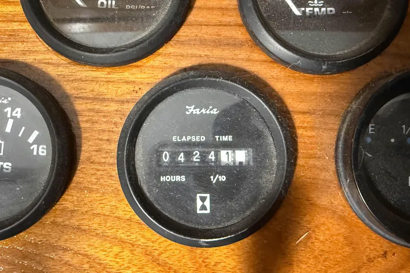 Slide: The Image of Close-up of Faria elapsed time gauge on 1977 Pacemaker FB Motor Yacht dashboard. - 14