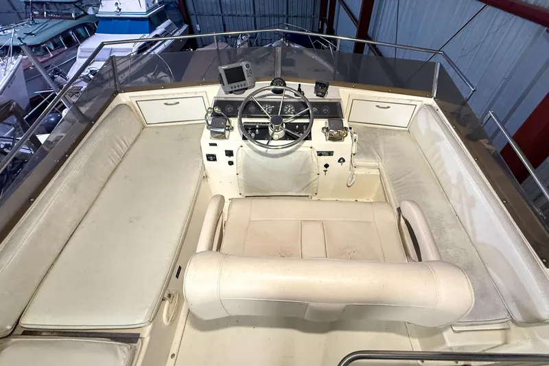Slide: The Image of Cockpit of a 1977 Pacemaker FB Motor Yacht with steering wheel and navigation equipment. - 21