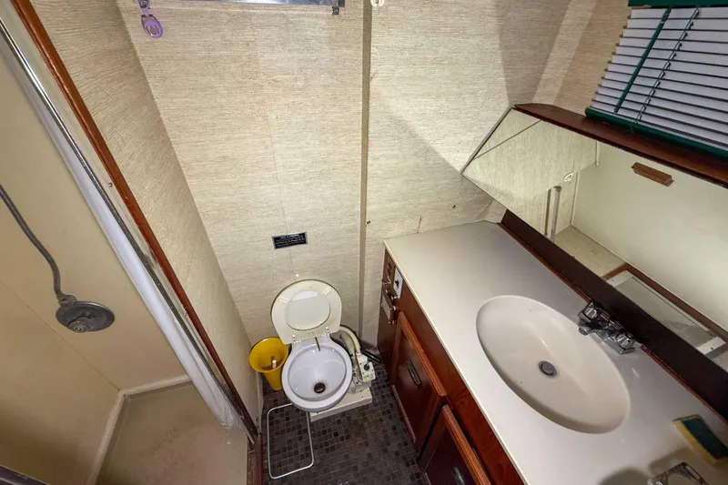Slide: The Image of Bathroom interior of 1977 Pacemaker FB Motor Yacht with shower, toilet, and sink. - 38