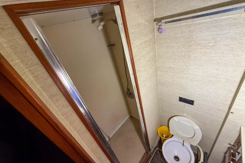Slide: The Image of 1977 Pacemaker FB Motor Yacht bathroom with shower and toilet. - 39