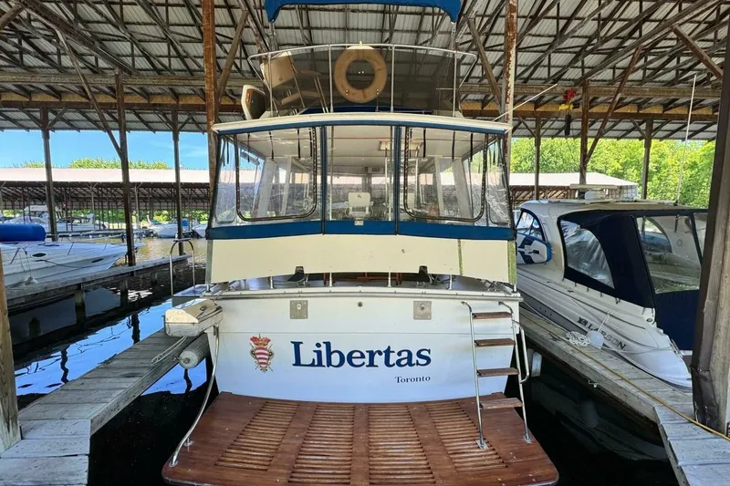 Slide: The Image of 1977 Pacemaker FB Motor Yacht "Libertas" docked in a marina, Toronto. - 4