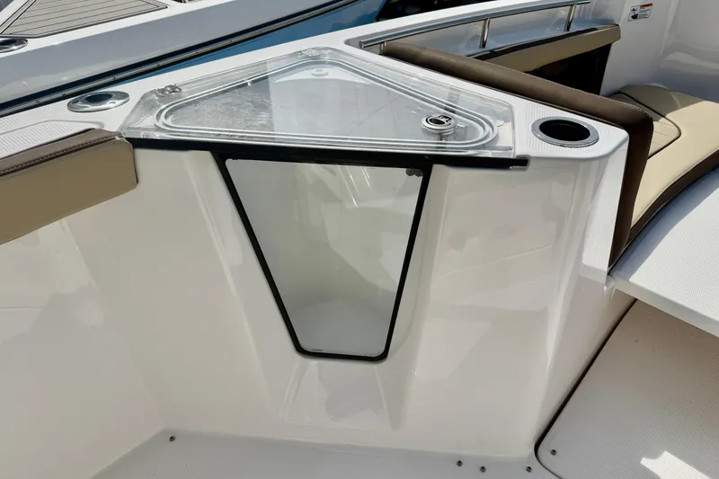 Slide: The Image of 2026 Yamaha Boats 252 FSH Sport interior detail with seating and storage compartment. - 14