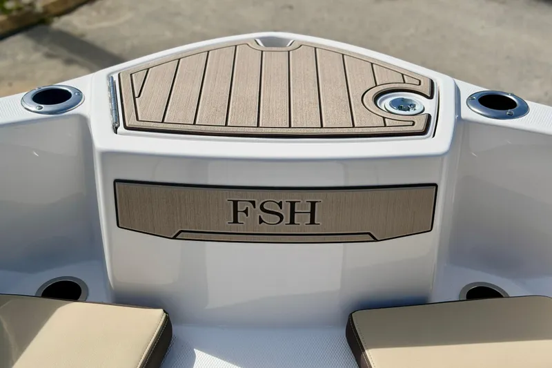 Slide: The Image of 2026 Yamaha Boats 252 FSH Sport, featuring sleek deck design and cup holders. - 18