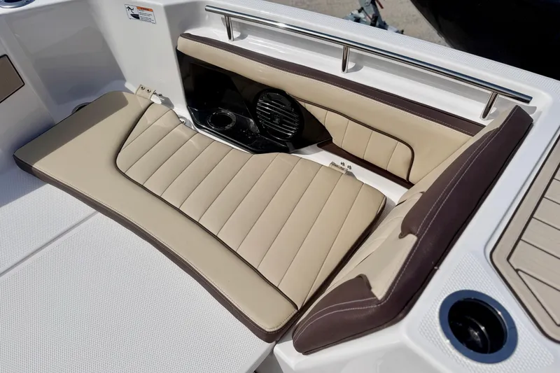 Slide: The Image of Luxurious seating on 2026 Yamaha Boats 252 FSH Sport, featuring beige and brown upholstery. - 19