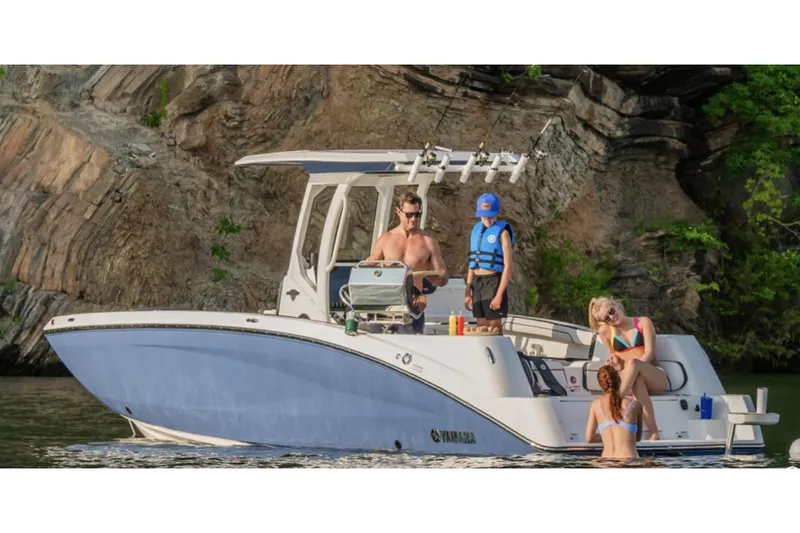 Slide: The Image of 2026 Yamaha Boats 252 FSH Sport, rear view, showcasing seating and deck features. - 2