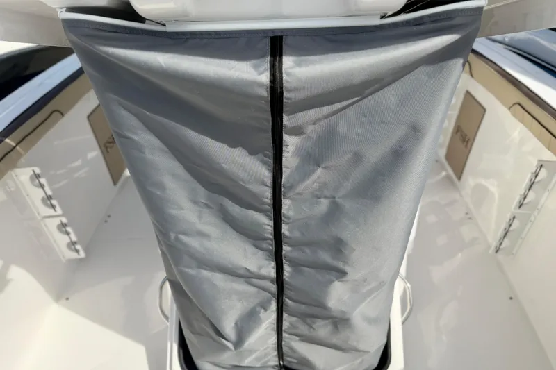 Slide: The Image of 2026 Yamaha Boats 252 FSH Sport interior with protective cover and sleek design elements. - 33