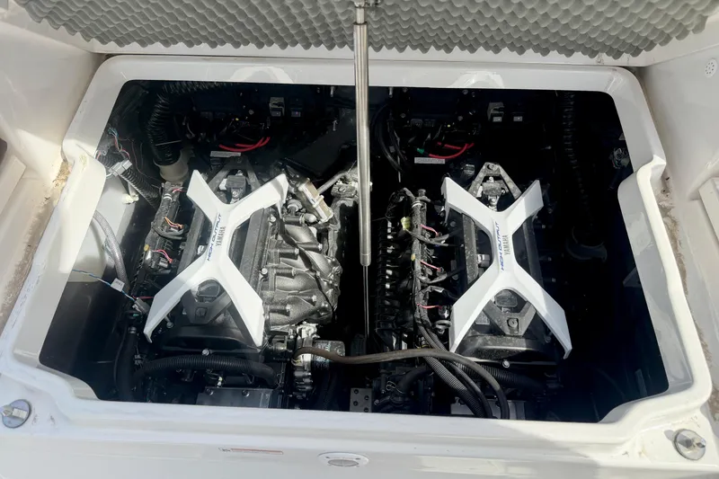 Slide: The Image of Engine compartment of 2026 Yamaha Boats 252 FSH Sport, showcasing dual engines. - 34