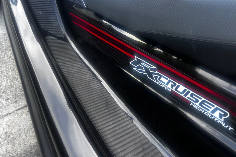 Slide: The Image of 2016 Yamaha WaveRunner FX Cruiser SVHO, close-up of logo and sleek design details. - 16