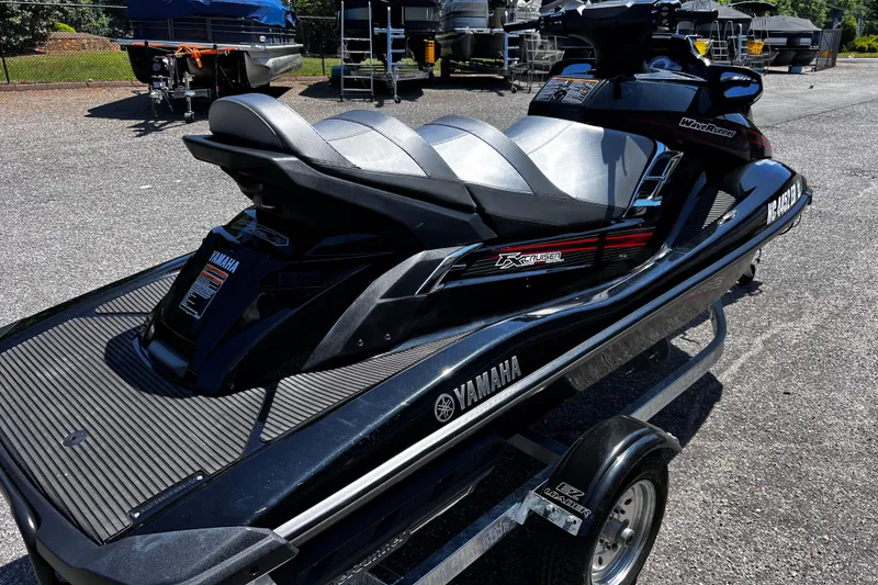 Slide: The Image of 2016 Yamaha WaveRunner FX Cruiser SVHO on trailer, parked outdoors. - 2