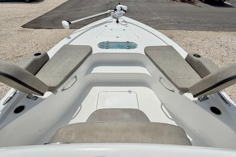 Slide: The Image of 2022 Sea Pro 248 Bay boat interior with seating and trolling motor. - 10