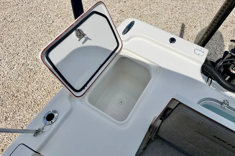 Slide: The Image of Open storage compartment on 2022 Sea Pro 248 Bay boat, showcasing interior space. - 26