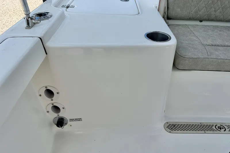 Slide: The Image of 2022 Sea Pro 248 Bay boat interior with seating and cup holder. - 29