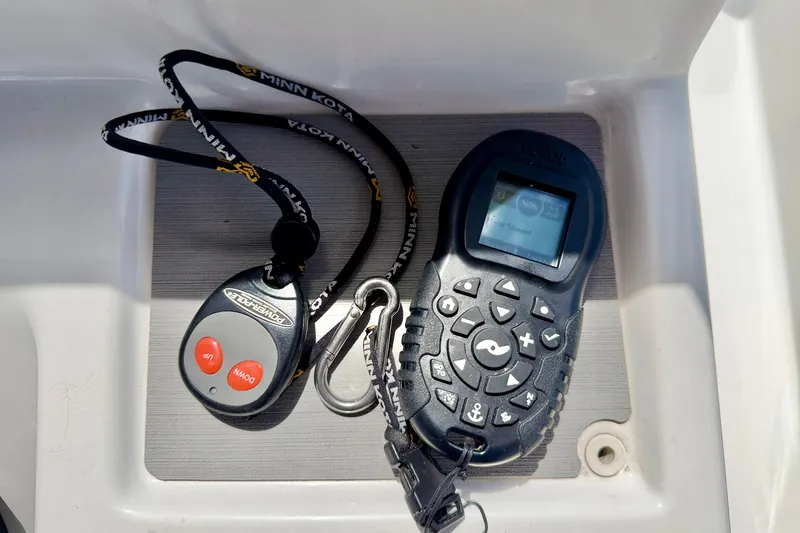 Slide: The Image of Remote controls for Minn Kota and Power-Pole on a 2022 Sea Pro 248 Bay boat. - 30