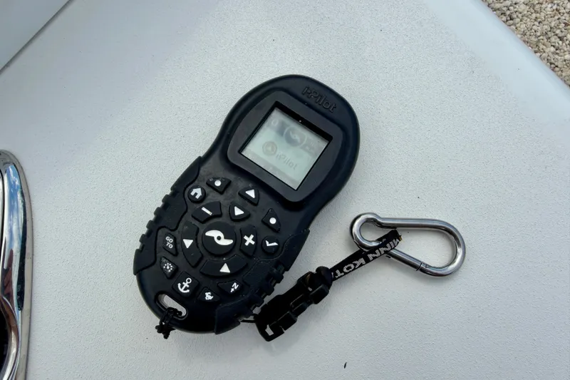 Slide: The Image of Remote control for Sea Pro 248 Bay 2022 boat, featuring i-Pilot system. - 38