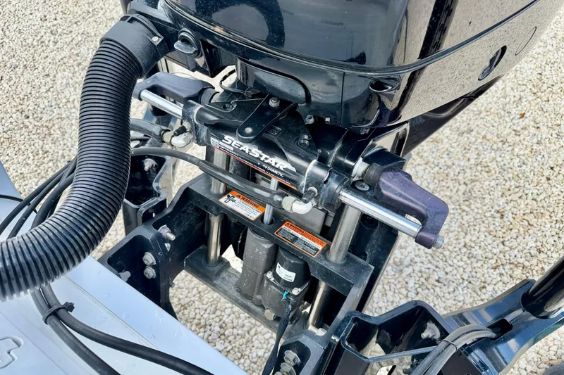 Slide: The Image of Close-up of 2022 Sea Pro 248 Bay boat engine components and hydraulic steering system. - 40