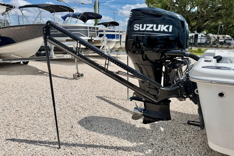 Slide: The Image of 2022 Sea Pro 248 Bay boat with Suzuki outboard motor on gravel lot. - 41