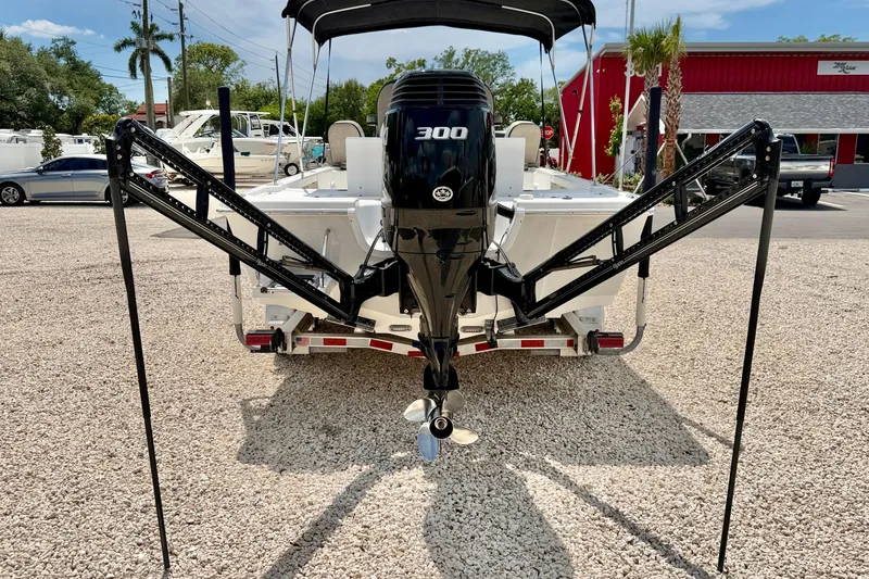Slide: The Image of 2022 Sea Pro 248 Bay boat with powerful 300 HP engine, parked on gravel. - 42