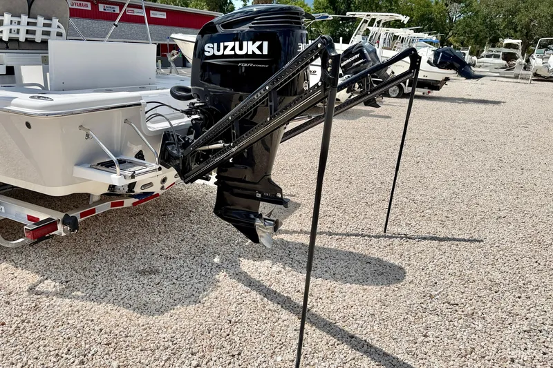 Slide: The Image of 2022 Sea Pro 248 Bay boat with Suzuki outboard motor on gravel lot. - 43