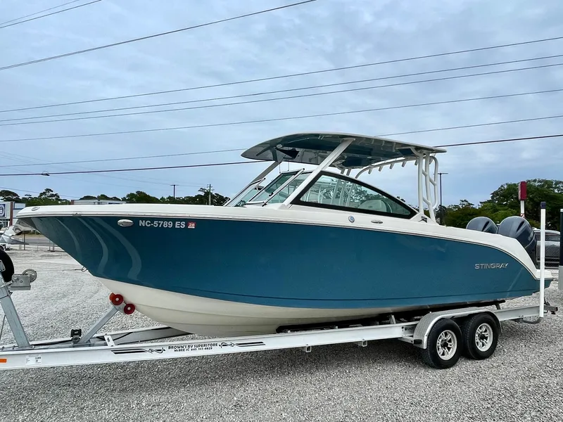 The Image of 2020 Stingray 269 DC boat on trailer, side view. - 0