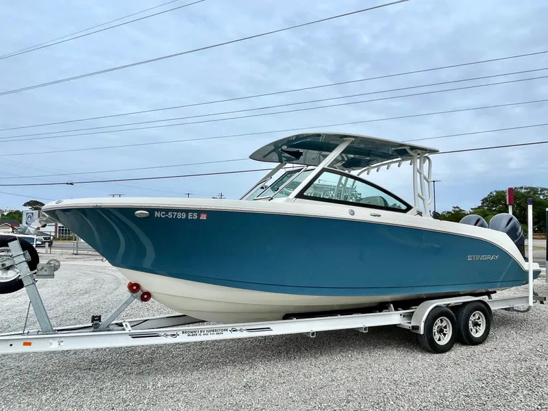Slide: The Image of 2020 Stingray 269 DC boat on trailer, side view. - 1