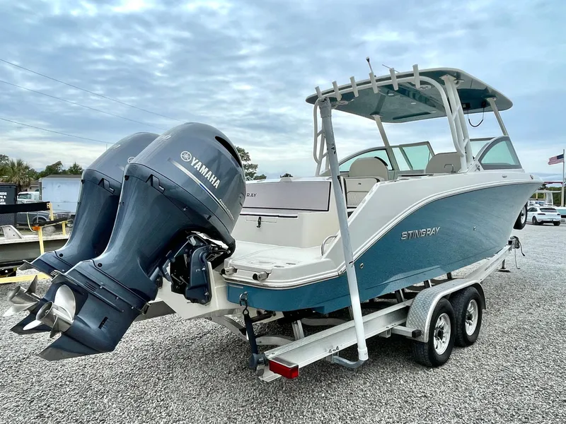 Slide: The Image of 2020 Stingray 269 DC boat with Yamaha engines on trailer. - 13