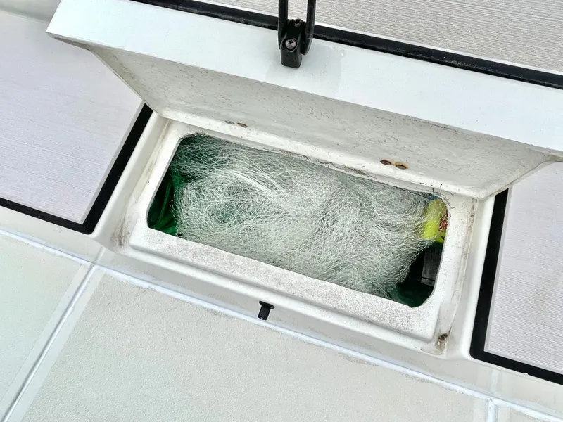Slide: The Image of Stingray 269 DC 2020 storage compartment with netting on boat. - 18